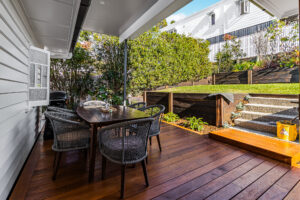 Queenslander renovation Bardon Brisbane with timber deck and outdoor dining area.
